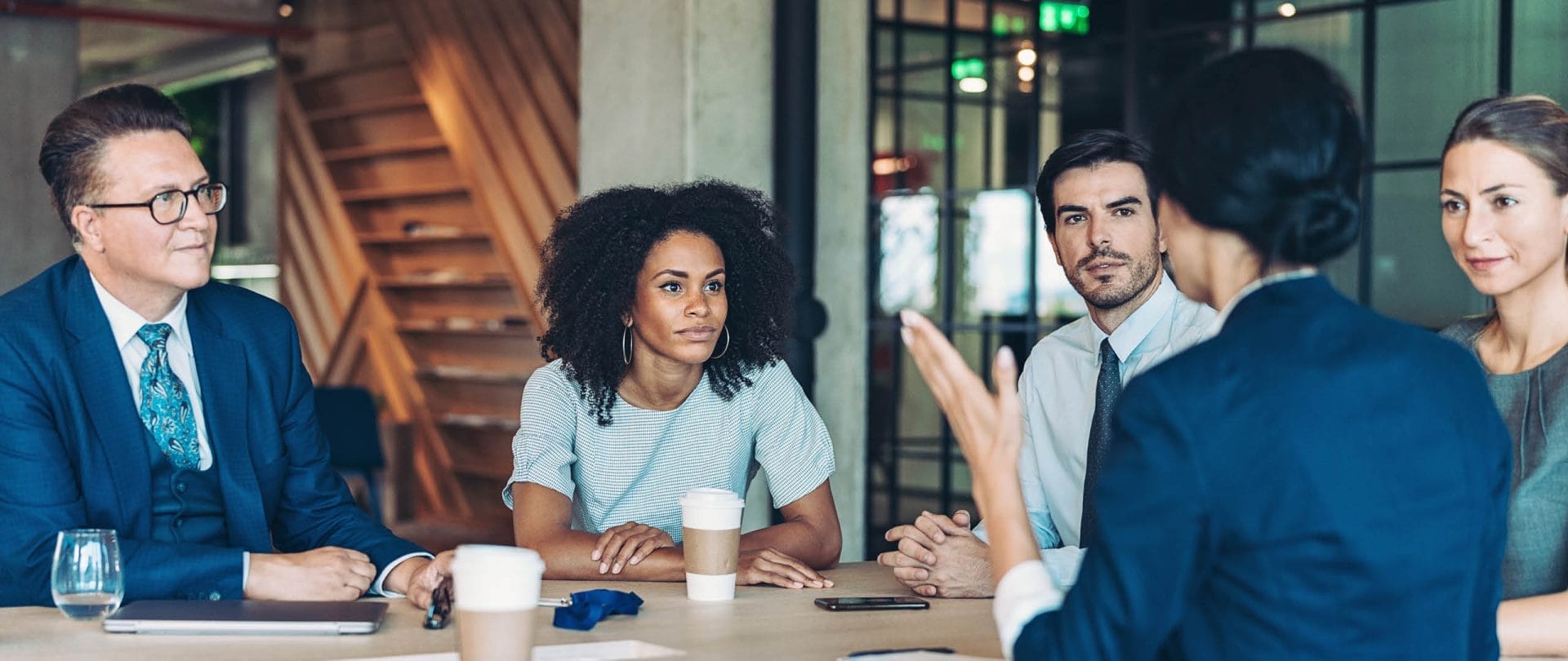 Business people sit at a table